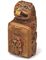 Carved with the figure of a lion, flanked