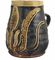 A STAFFORDSHIRE SLIPWARE MUG  