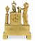 AN EMPIRE ORMOLU STRIKING MANTEL CLOCK  