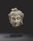 TETE DE BODHISATTVA EN SCHISTE GRIS 