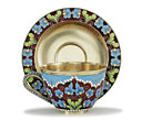 A silver and cloisonné cup and saucer