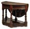 A CHARLES I WALNUT AND OAK FOLDING TABLE