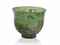 A TRANSPARENT GREEN GLASS CUP  