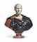 A CARVED POLYCHROME MARBLE BUST OF JULIUS