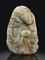 A MOTTLED PALE CELADON AND BROWN JADE