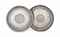 TWO ENGRAVED AND REPOUSSÉ SILVER TRAYS  