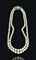 A TWO-STRAND NATURAL PEARL AND TURQUOISE