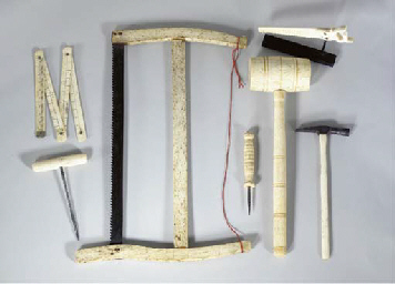 A GROUP OF SEVEN SCRIMSHAW WHALEBONE TOOLS , AMERICAN, LATE 19TH