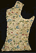A bodice panel of ivory linen from a lady's embroidered jacket, worked with curling gilt thread tendrils with pea pods, pansies, fruit, butterflies, dragonflies and caterpillars, English, circa 1620-30