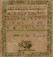 A SILK ON SILK NEEDLEWORK SAMPLER  