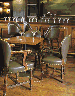 A SET OF EIGHT LEATHER UPHOLSTERED OAK CHAIRS  