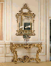 A LOUIS XV STYLE GILTWOOD CONSOLE TABLE AND A LOUIS XVI STYLE GILT COMPOSITION MIRROR 