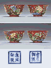 A FINE AND RARE PAIR OF IMPERIAL FAMILLE VERTE CORAL-GROUND BOWLS