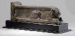 AN EGYPTIAN BRONZE LION SUPPORT  