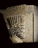 AN ACHAEMENID STONE RELIEF FRAGMENT  