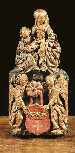 A Polychrome carved wood relief of Anna Selbdritt seated above two angels centred by a coat-of-arms 