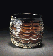AN UMAYYAD OR EARLY ABBASID AMBER GLASS BEAKER  