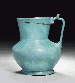 AN OPAQUE TURQUOISE GLASS JUG  