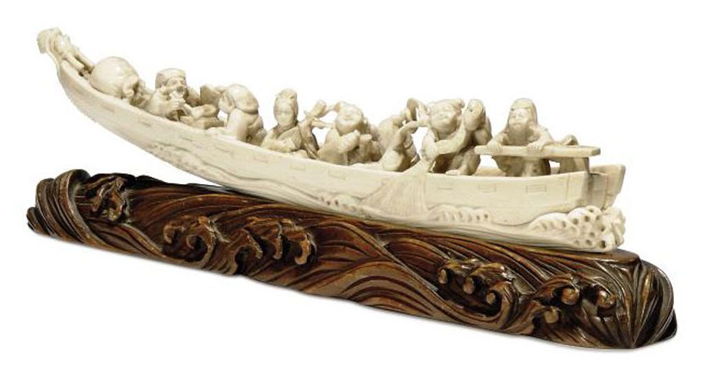 A JAPANESE IVORY CARVING OF A LONG BOAT , MEIJI PERIOD (18681912