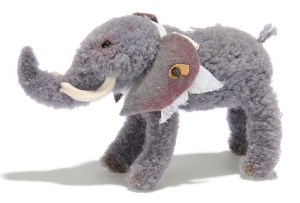 A STEIFF POMPOM ELEPHANT, (1510,0), standing, grey, felt ears and
