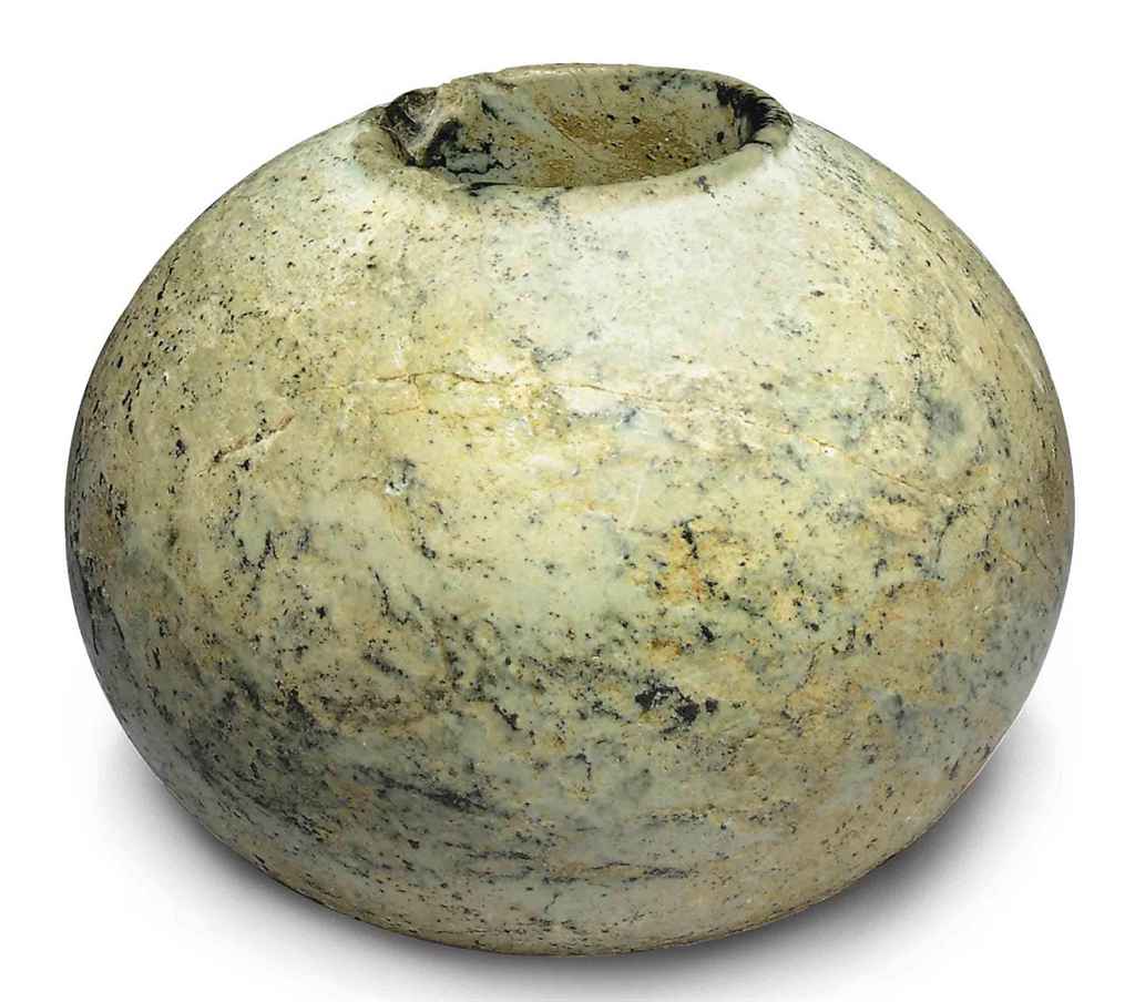 AN EGYPTIAN STONE MACE HEAD , CIRCA 3RD MILLENNIUM B.C. Christie's