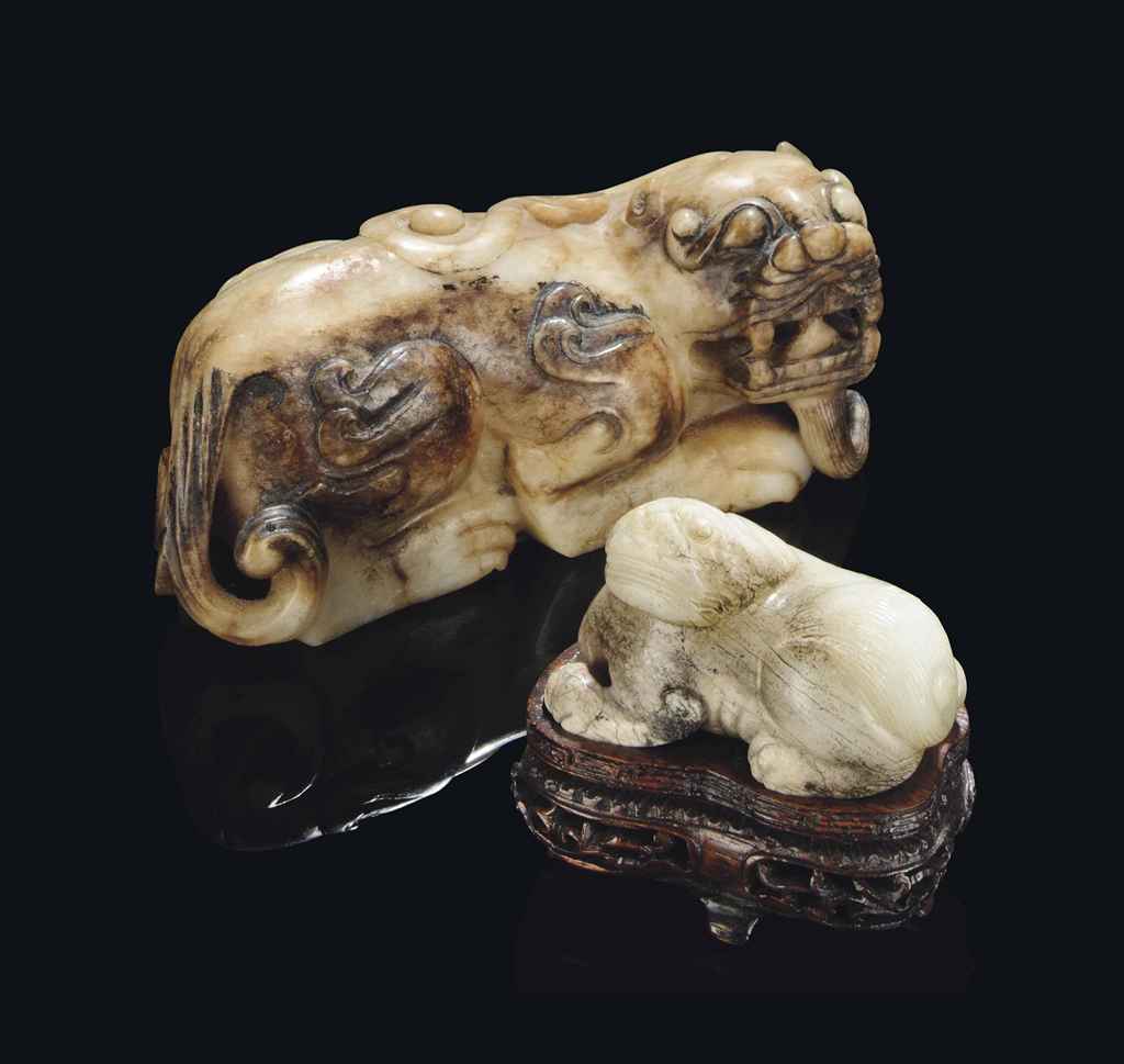 TWO CHINESE JADE CARVINGS OF MYTHICAL BEASTS , MING DYNASTY (13681644