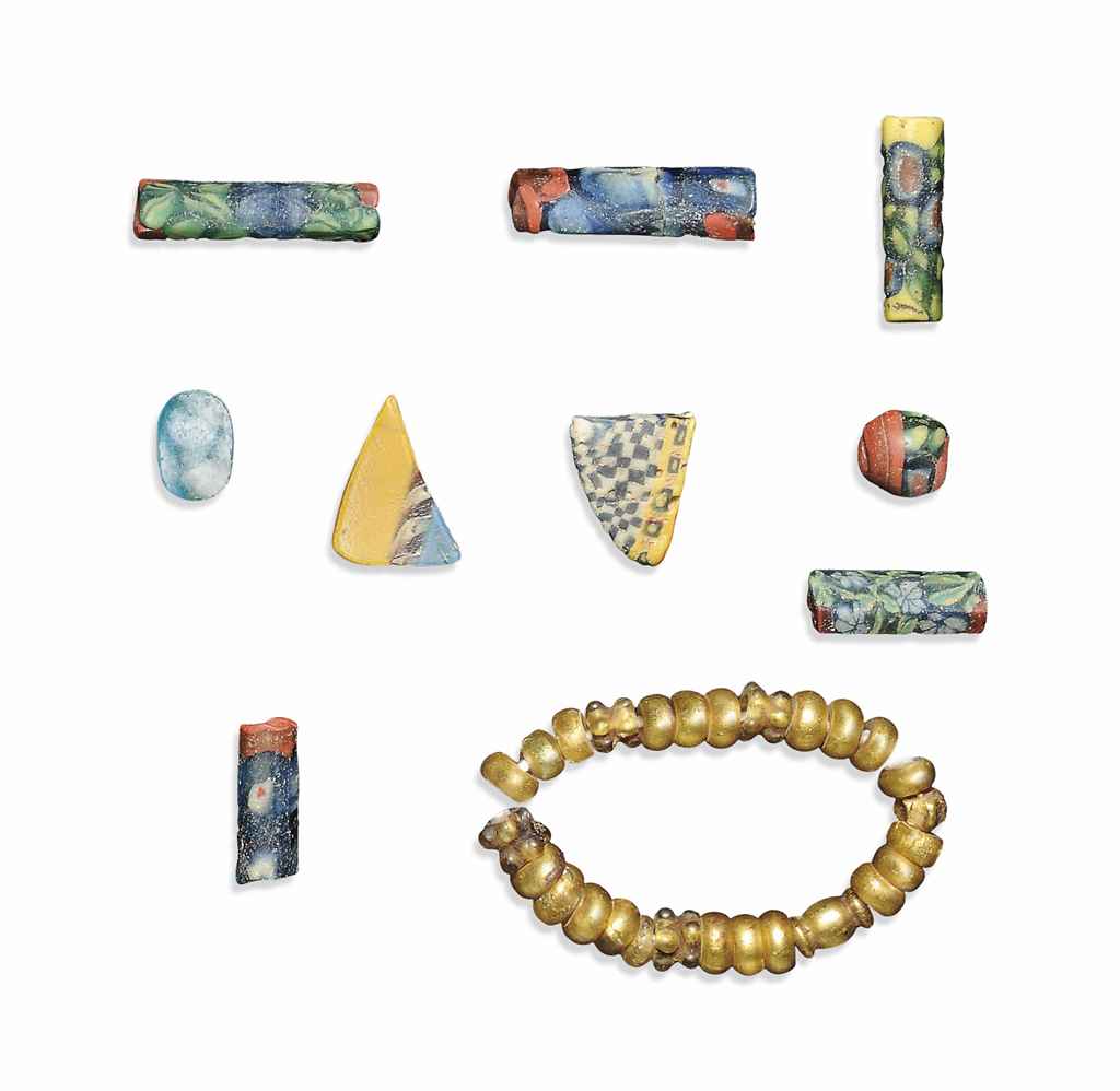 EGYPTIAN GLASS BEADS AND FRAGMENTS , CIRCA 1ST CENTURY B.C.1ST CENTURY