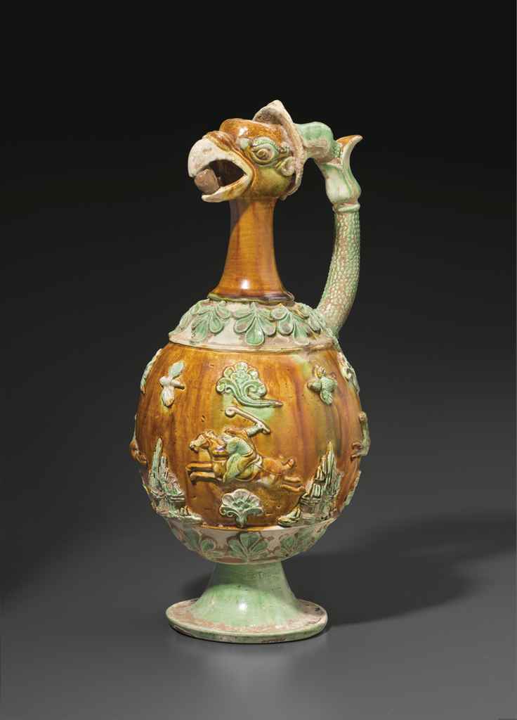 A VERY RARE SANCAIGLAZED POTTERY PHOENIXHEAD EWER , CHINA, TANG