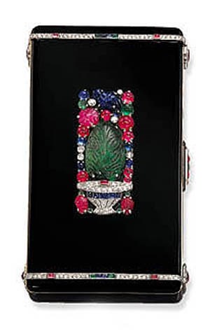 A rare Art Deco enamel and multi-gem Tutti Frutti vanity case, by Cartier, signed Cartier, Paris, London, New York, No. 9513a, circa 1925. 9 x 5 x 1.5  cm, with French assay marks. Sold for CHF99,875 on 17 May 2001  at Christie’s in Geneva