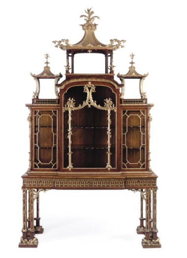 A George II parcel-gilt padouk cabinet-on-stand, attributed to Thomas Chippendale, 1755-1760. 111½  in (283.5  cm) high; 64½  in (163.5  cm) wide; 26¼  in (66.5  cm) deep. Sold for £2,729,250 on 18 June 2008  at Christie’s in London
