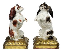 A PAIR OF ORMOLU-MOUNTED CONTINENTAL MODELS OF BOLOGNESE HOUNDS
