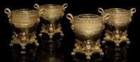 THE FOLEY WINE COOLERS
A SET OF FOUR GEORGE III SILVER-GILT WINE-COOLERS, COLLARS AND LINERS IN THE EGYPTIAN STYLE