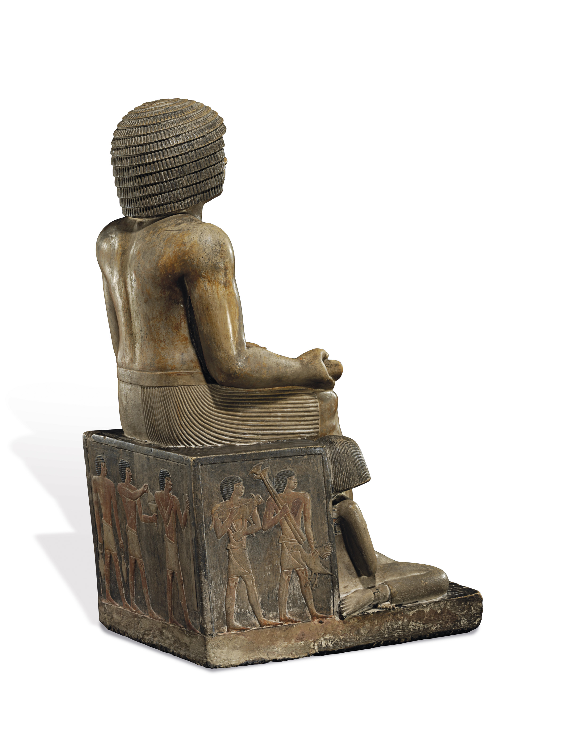 AN EXCEPTIONAL EGYPTIAN PAINTED LIMESTONE STATUE FOR THE INSPECTOR OF