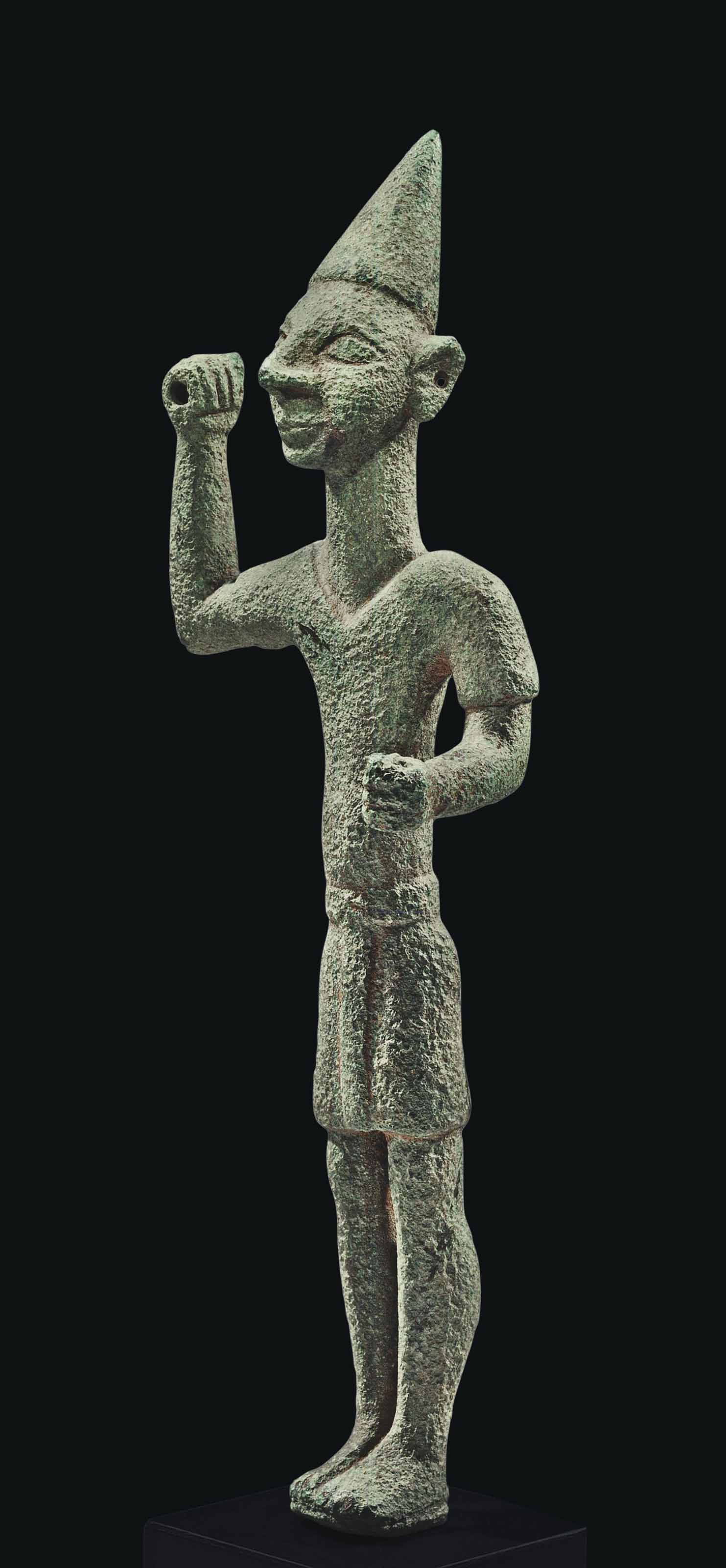 A CANAANITE BRONZE SMITING GOD , LATE BRONZE AGE, CIRCA 15501200 B.C. Christie's