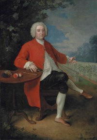 Portrait of Ralph Crathorne (d. 1755), of Ness Hall, North Riding, Yorkshire, full-length, seated at a table with grapes, peaches, a riding hat, a hammer and a pruning knife, in a landscape, gesturing to a vinery wall, in a landscape