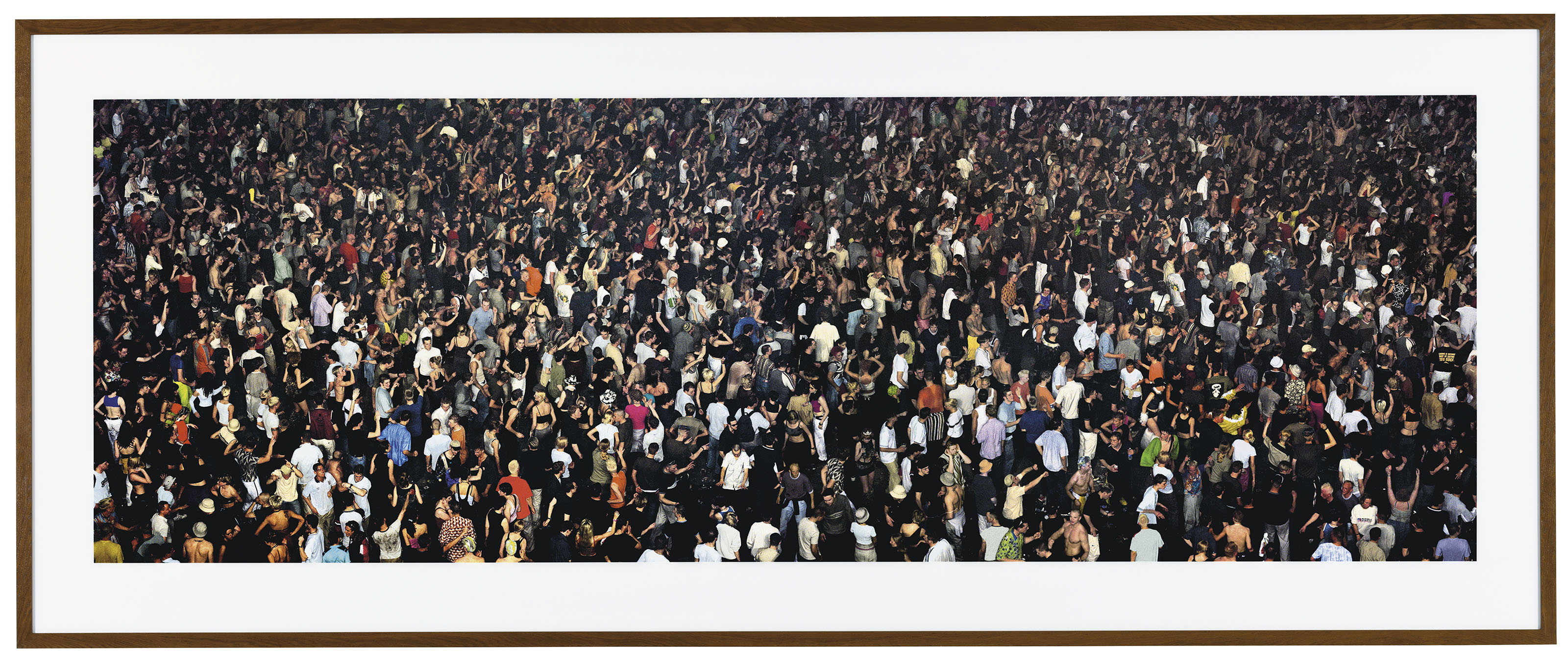 Andreas Gursky (b. 1955), May Day IV. Overall 82 x 200  in (208.3 x 508  cm). Estimate £500,000-700,000. This lot is offered in Masterpieces of Design & Photography on 3 October 2017  at Christie’s in London