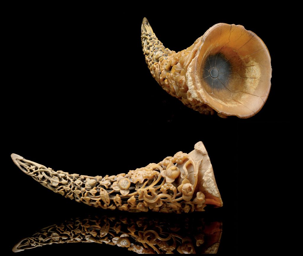 A LARGE CARVED RHINO HORN CARVING , 19TH CENTURY Christie's