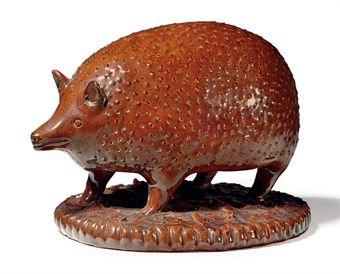 A REDWARE SALT-GLAZED HEDGEHOG 