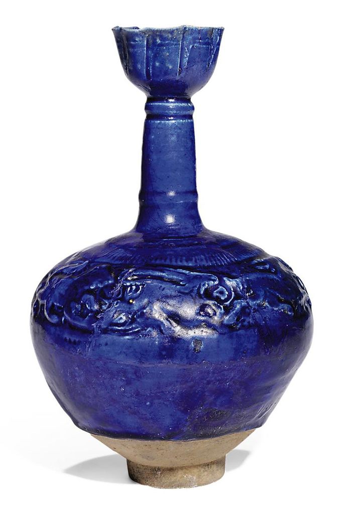 A MOULDED COBALT-BLUE GLAZED POTTERY BOTTLE , PROBABLY KASHAN, IRAN
