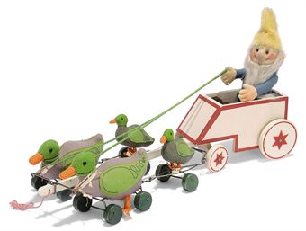 A STEIFF DUCK DRAWN WAGON, (2110/812), white and red painted wooden wagon pulled by two felt ducks (2110,42 ex) and two smaller felt ducks (2106 ex), green and black blue stitched detail, orange felt beaks and feet, black glass eyes, larger ducks with white ribbons, green painted wooden eccentric wheels and small FF buttons with white card tags, green cord reins, driven by a felt Dwarf Puck (20), brown and black glass eyes, white mohair beard, jointed, integral blue, orange and green felt clothes, brown shoes, yellow mohair hat and FF button with remains of white tag, 1920-27 --20in. (51cm.) long overall (Puck slightly faded) 