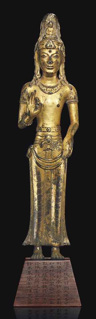 A RARE AND FINELY CAST GILT-BRONZE FIGURE OF ACUOYE GUANYIN ...