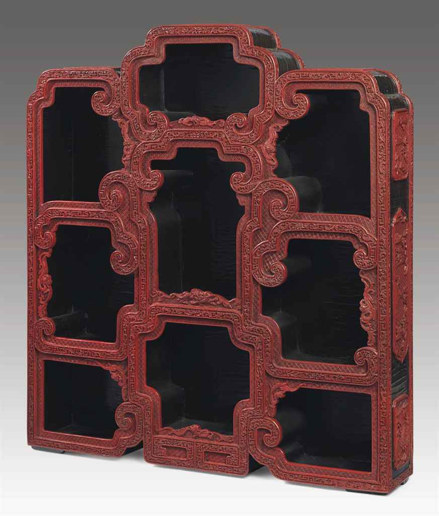 A RARE CARVED RED LACQUER HANGING DISPLAY CABINET