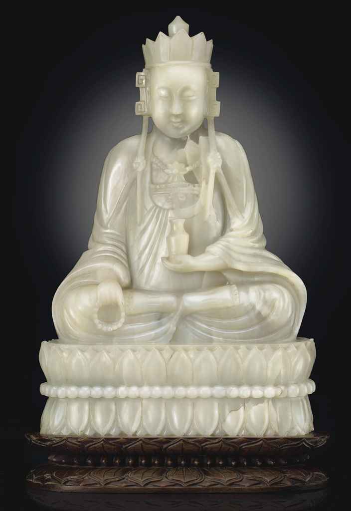 AN UNUSUAL LARGE PALE GREENISH-WHITE JADE FIGURE OF A BODHIS...