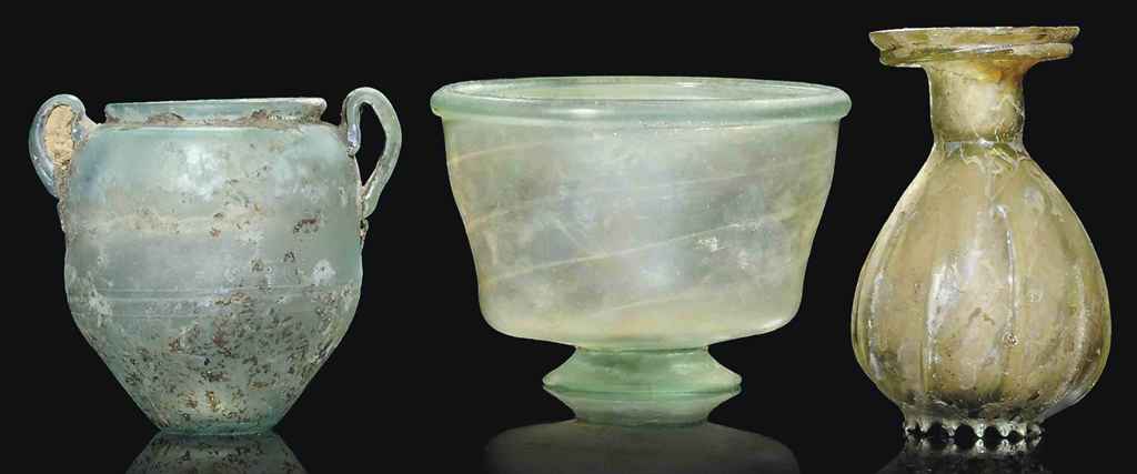 A ROMAN GREEN GLASS FOOTED BOWL