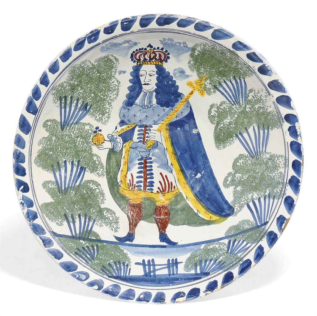 AN ENGLISH DELFT POLYCHROME ROYAL PORTRAIT CHARGER