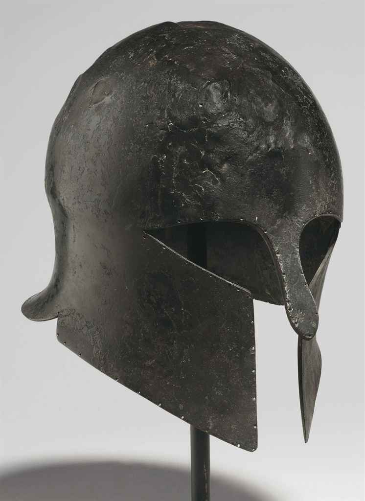 A GREEK BRONZE HELMET OF CORINTHIAN TYPE , ARCHAIC PERIOD, CIRCA MID