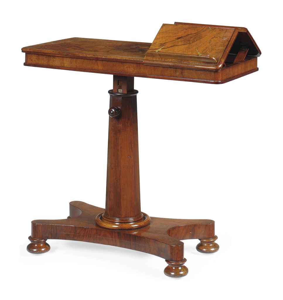 AN EARLY VICTORIAN FIGURED WALNUT READING TABLE