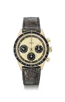 Rolex. A fine and rare 18K gold chronograph wristwatch with champagne dial 