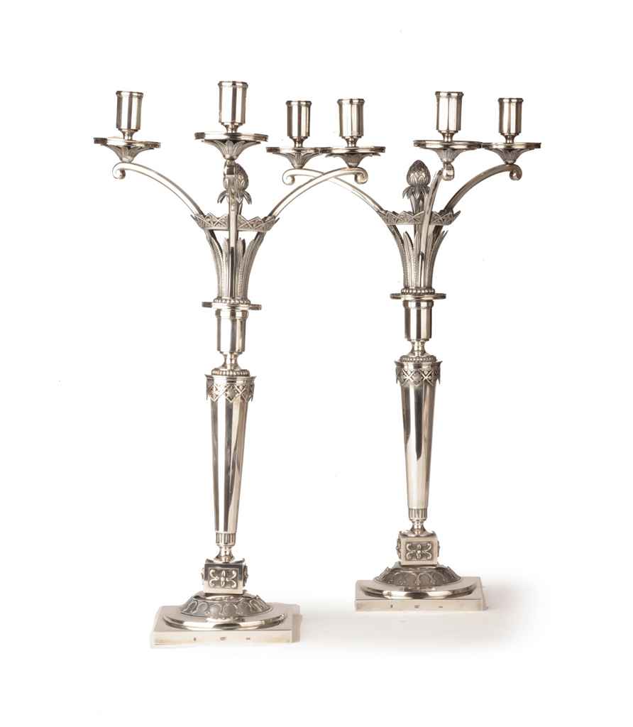 A pair of German silver three-light candelabra