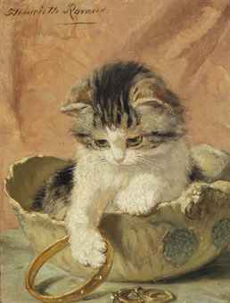 A kitten playing with jewelry  